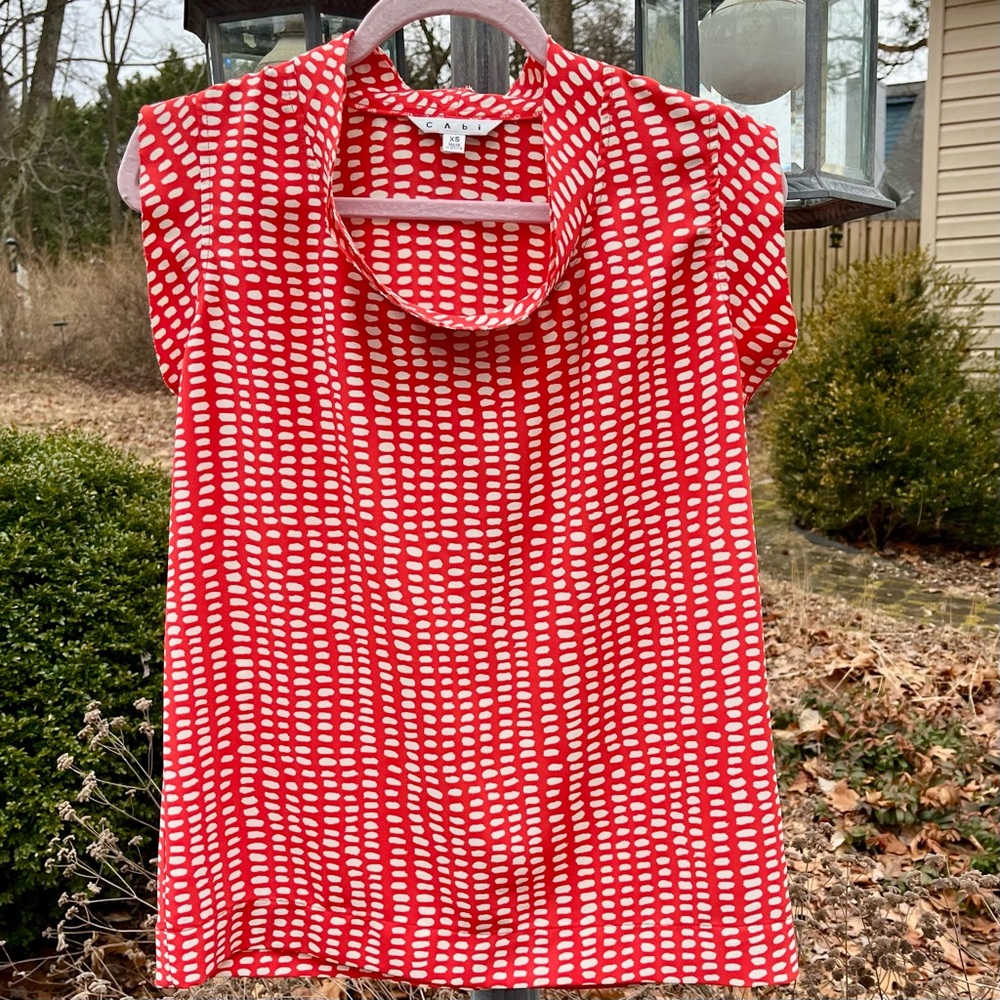 CAbi Madeleine top, orange with abstract cream dots
